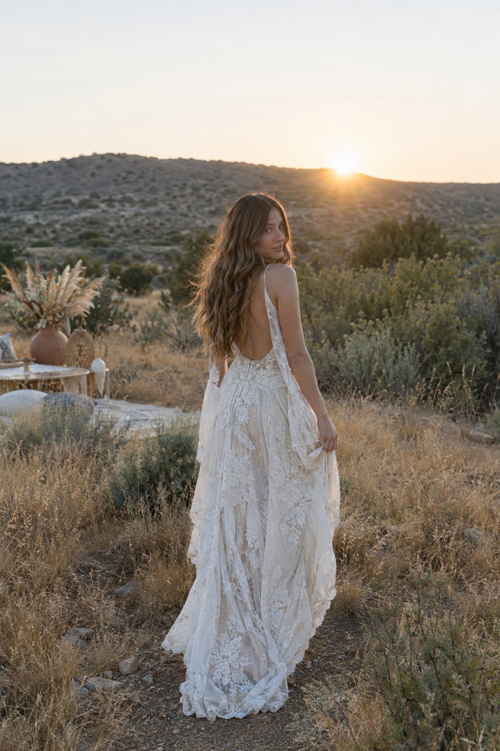 Boho bride in the desert at sunset in the Golden Boho Sundown look – before